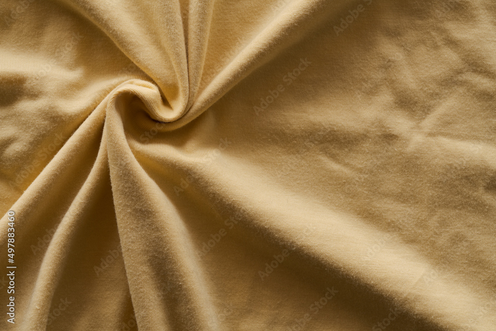 closeup shot of yellow premium cotton fabric closeup shot of yellow premium cotton fabric