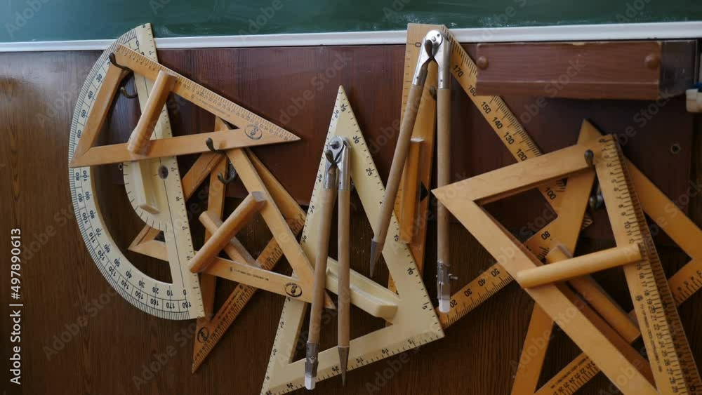 Video Stock Set of big rulers. compasses and protractors hanging in