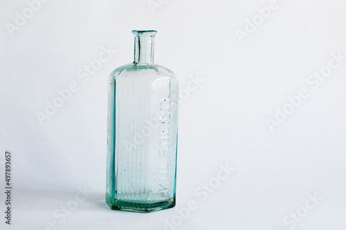 Antique blue glass bottle isolated
