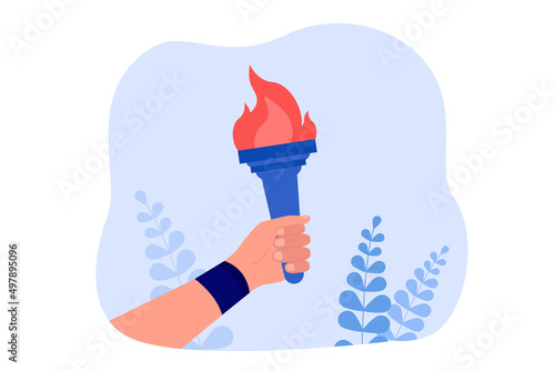 Human hand of leader holding torch stick with burning flame