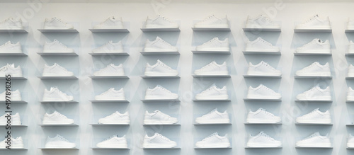 Store wall with white sneakers