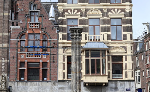 Amsterdam Rokin Street Historic Brick Building Facades Close Up with Stone Column, Netherlands © Monica