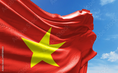 Schilderij op canvas Vietnamese Flag is Waving Against Blue Sky with Clouds