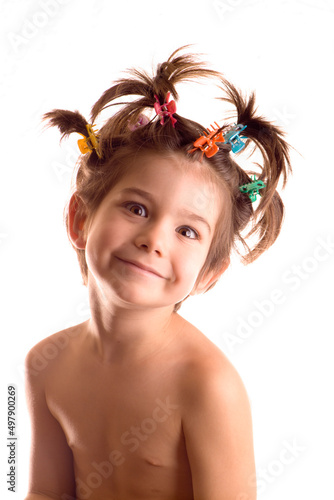 Portrait of funny little boy or girl with wild hair on white background.