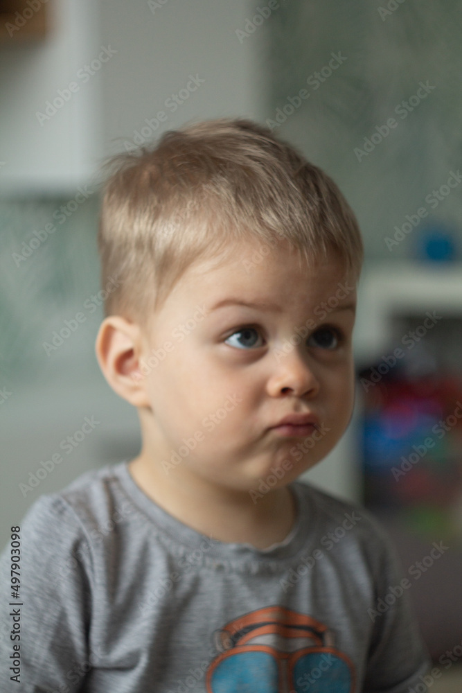 little boy looks doubtfully little boy looks doubtfully