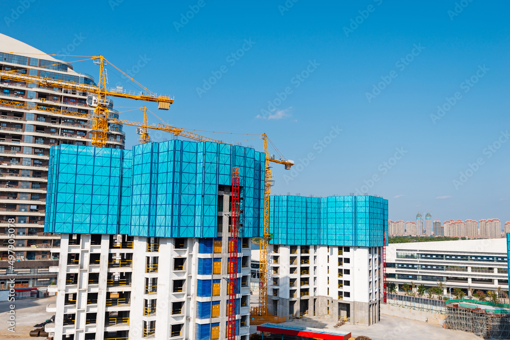 Construction site with cranes in the city Construction site with cranes in the city