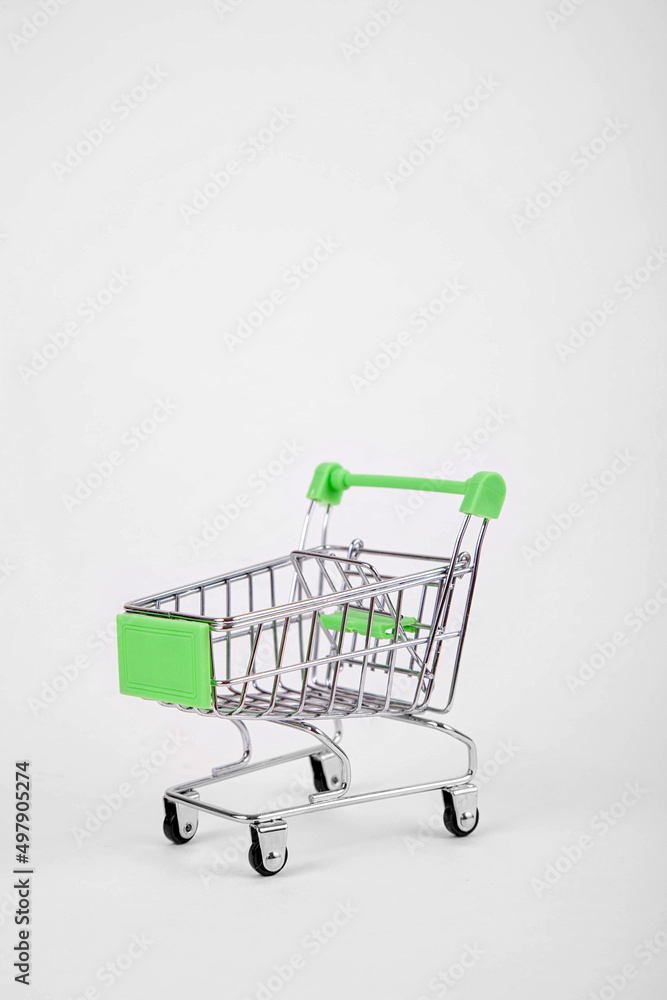 Empty shopping cart on wheels on a white background