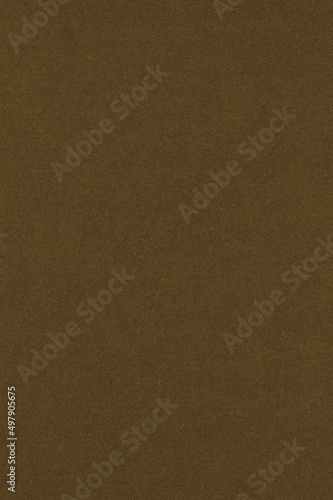 Dark brown colored paper texture. Textured surface with cellulose fibers. Vertical background. Cigar coloured wallpaper
