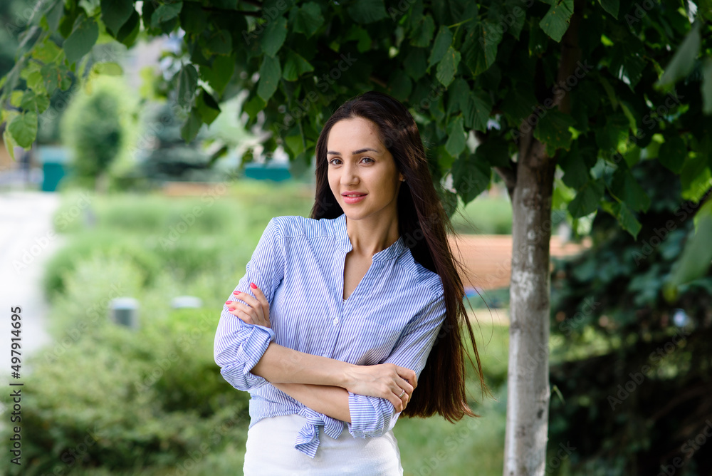 Portrait of a mediterranean, smiling woman with long, black hair Portrait of a mediterranean, smiling woman with long, black hair