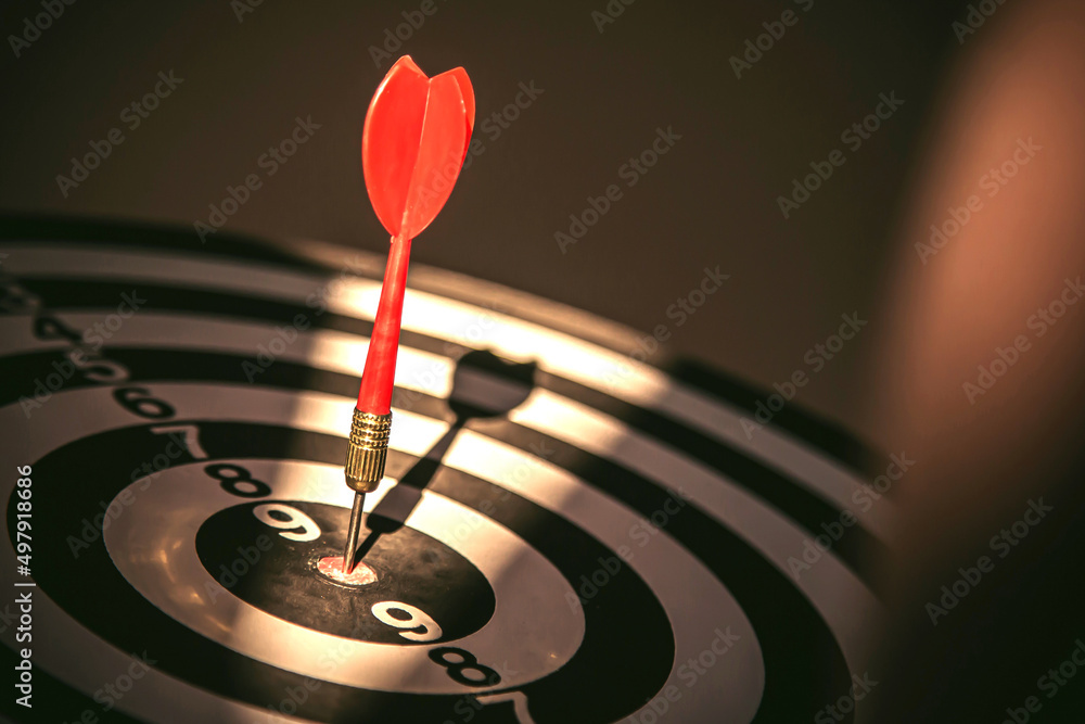 Bullseye target goal or dartboard has dart arrow throw hitting center shooting for financial business targeting planning to winner concept. Bullseye target goal or dartboard has dart arrow throw hitting center shooting for financial business targeting planning to winner concept.