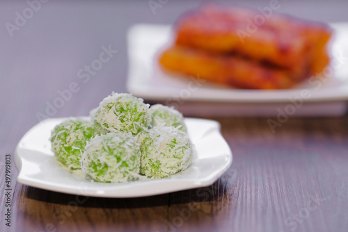 The Populous Fried Spicy popiah is spicy and crunchy in malay language is "Popia Sira Sambal" and Malay traditional delicacy,  called buah melaka on wooden table