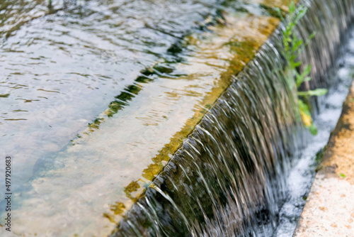 Water running down the stone step