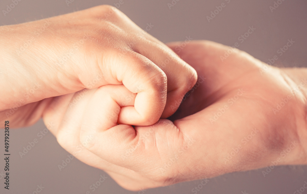 Male and child hands connected each other together and forever. Woman and kid hands connect with each other. Friendly handshake, friends greeting. Rescue, helping hand. Man help hands, protection Male and child hands connected each other together and forever. Woman and kid hands connect with each other. Friendly handshake, friends greeting. Rescue, helping hand. Man help hands, protection