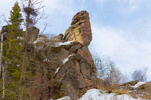 Rock Steadfast Tin Soldier is a part of Kitayskaya Stenka is rock pillar in the Stolby Nature Reserve in Krasnoyarsk, Russia. Springtime landscape in Siberia photo