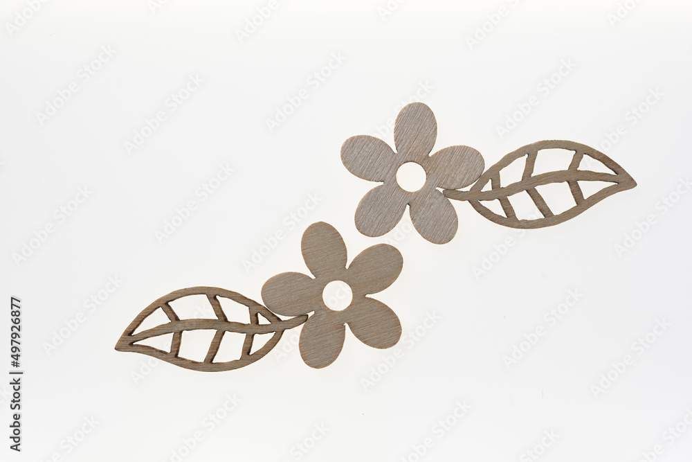 wooden flower and leaf shapes on a white background