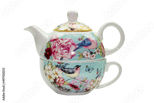Porcelain teapot with flower and bird pattern on a white background