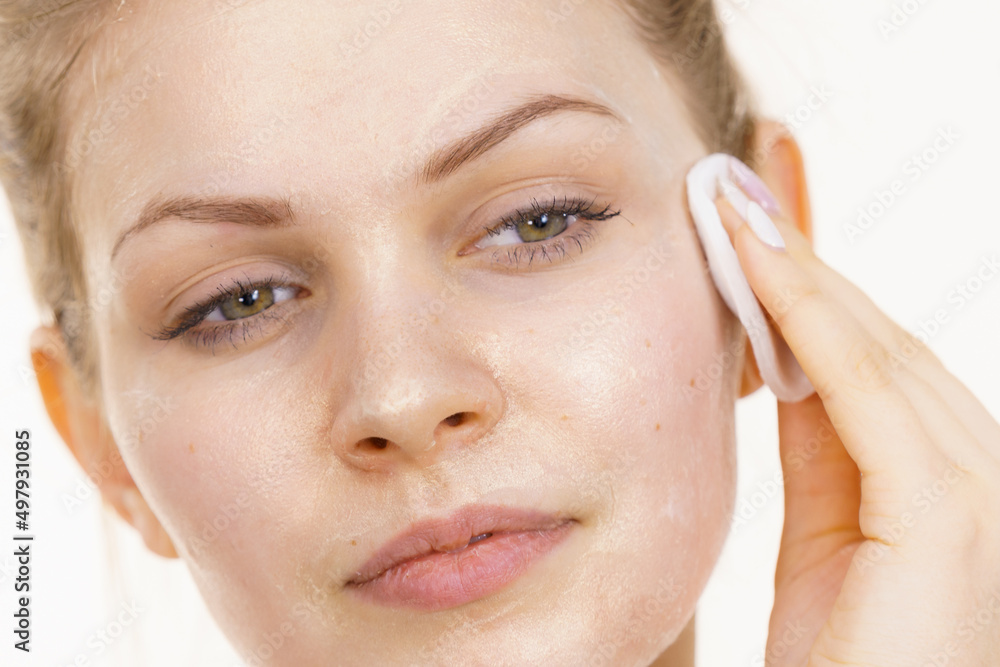 Fototapeta premium Girl removes mask cosmetic