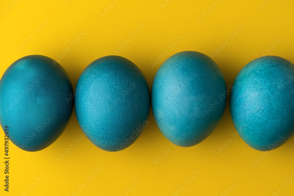 Blue easter eggs on yellow background. Colors of the flag of Ukraine