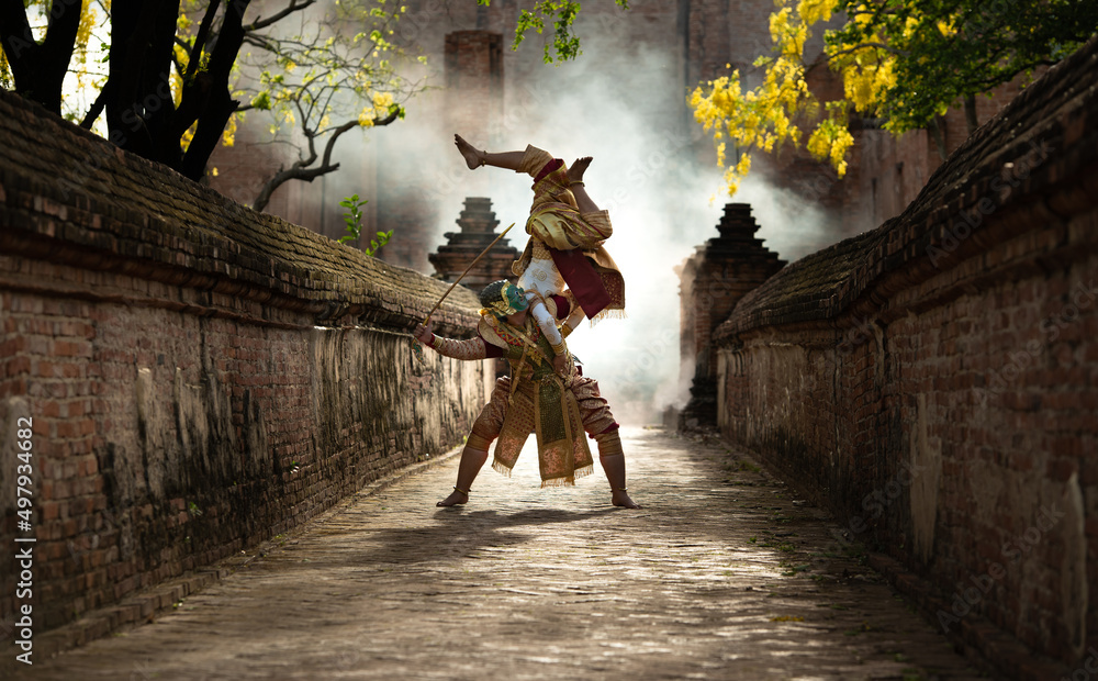 Khon, Is a classical Thai dance in a mask. In Ramayana literature, this is  the battle between the giant and Hanuman. Stock Photo | Adobe Stock