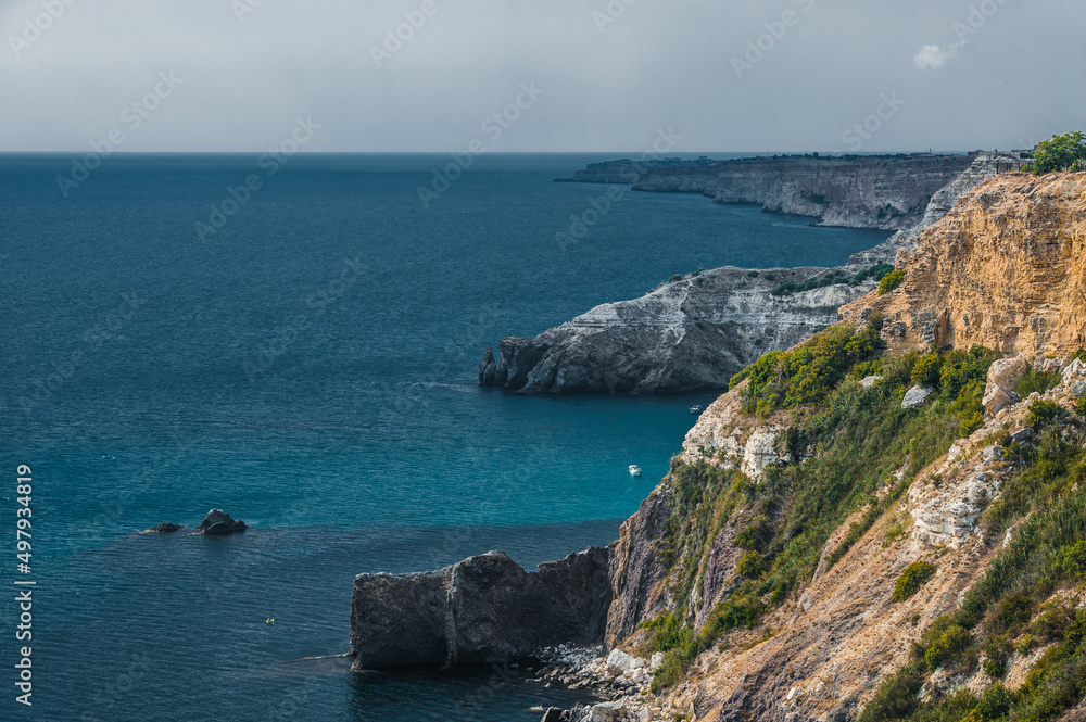 The coast at the cape Fiolent. Top view on sea and rocks. Crimea The coast at the cape Fiolent. Top view on sea and rocks. Crimea