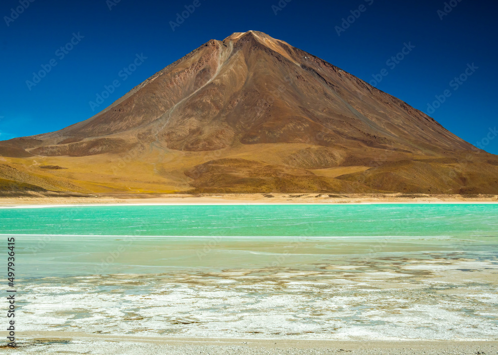 Licancabur  volcano and turquoise lagoon in Bolivia