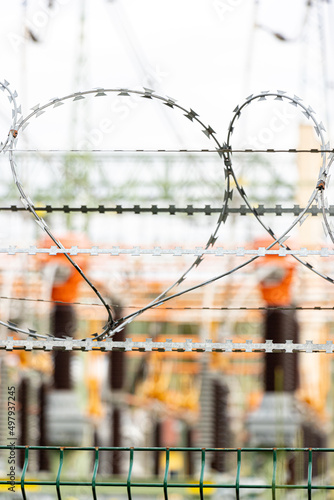 Barbed wire on a fence restricting entry to an electricity substation