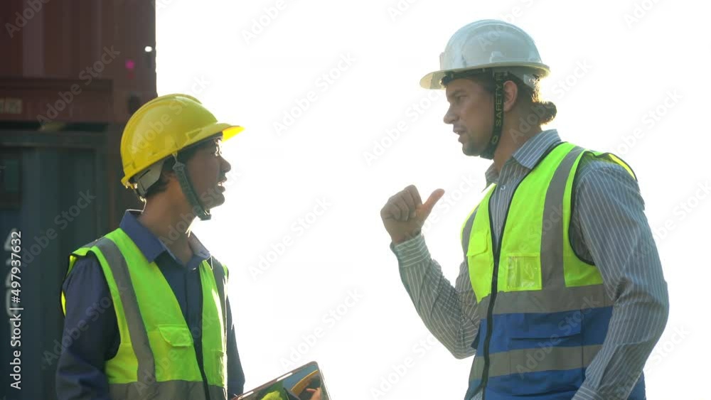 diversity worker foreman and secretary using document file meeting with worker to checking control loading Containers box at warehouse logistic in Cargo freight ship for import export in harbor. diversity worker foreman and secretary using document file meeting with worker to checking control loading Containers box at warehouse logistic in Cargo freight ship for import export in harbor.