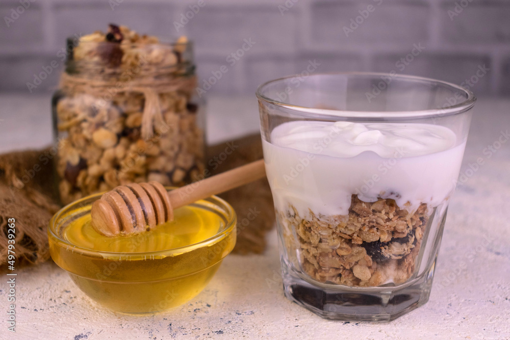 Greek yogurt dessert with granola and honey. Greek yogurt dessert with granola and honey.