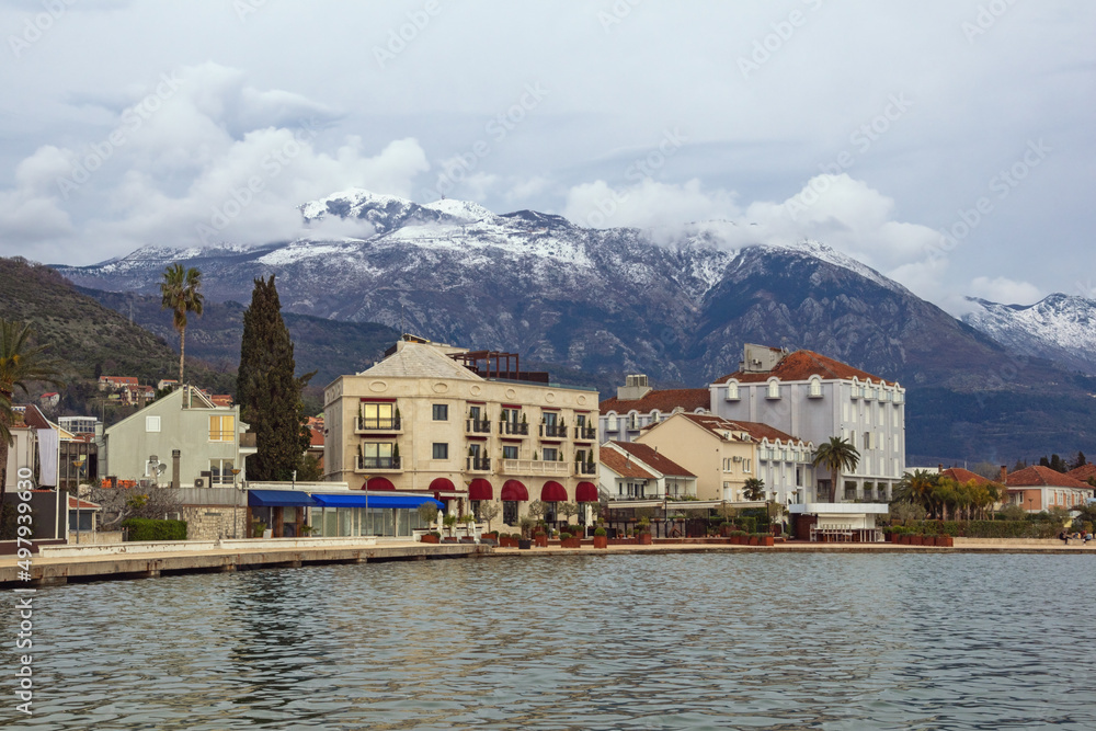 Overcast. Embankment of Tivat city on cold cloudy day. Montenegro, Adriatic Sea, Bay of Kotor