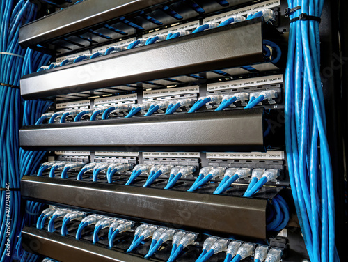 Connect data switches to patch panels using UTP patch cords.