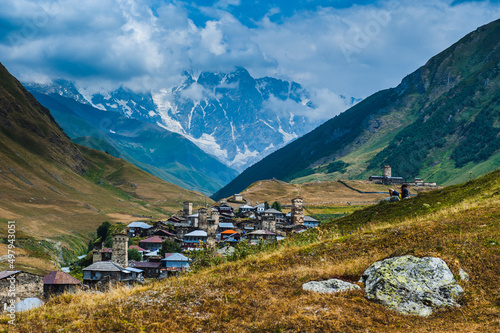 Village Ushguli landscape with massive rocky mountains