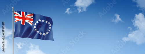 Cook Islands flag isolated on a blue sky. Horizontal banner