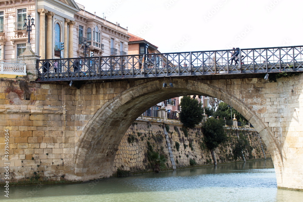 The Segura river as it passes through the city of Murcia, with the bridge of Los Peligros in the foreground
