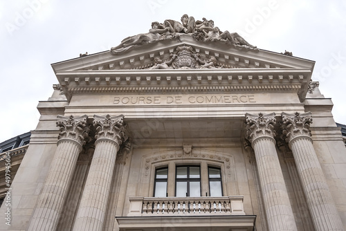 Architectural details of old Paris buildings: Bourse de Commerce (Commodities Exchange), circular building has a history dating back to XVI century. Current building dates back to 1886. Paris. France.