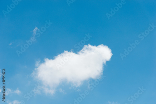 Single white cloud on blue sky
