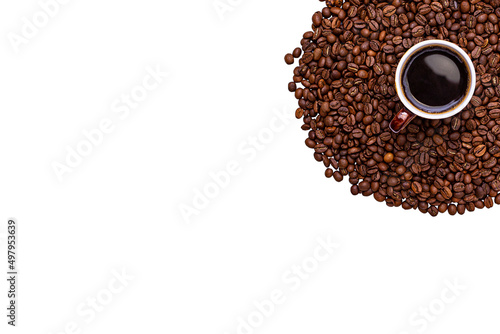 Cup of coffee on coffee beans isolated on white background.