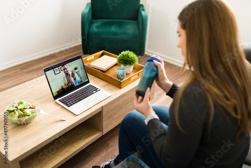 Young woman on a video call with a nutritionist photo