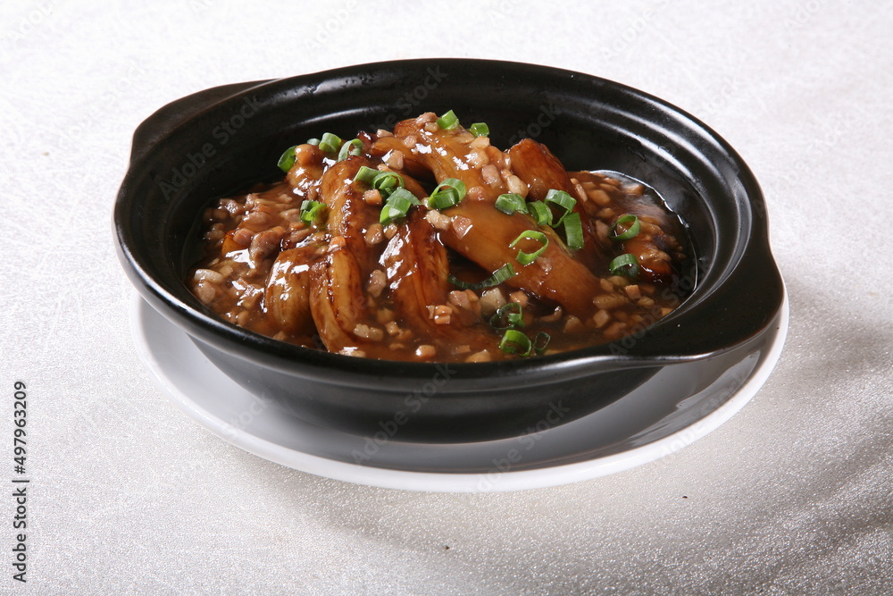 Fish-flavored eggplant in a bowl side view on grey background singapore food Fish-flavored eggplant in a bowl side view on grey background singapore food