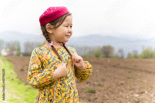 girl in a national headdress. Spring, Nowruz holiday. Kazakh girl. Central Asia, Kazakhstan. photo