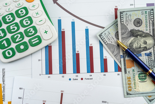 Paper chart diagram report with dollar bills. Business documents
