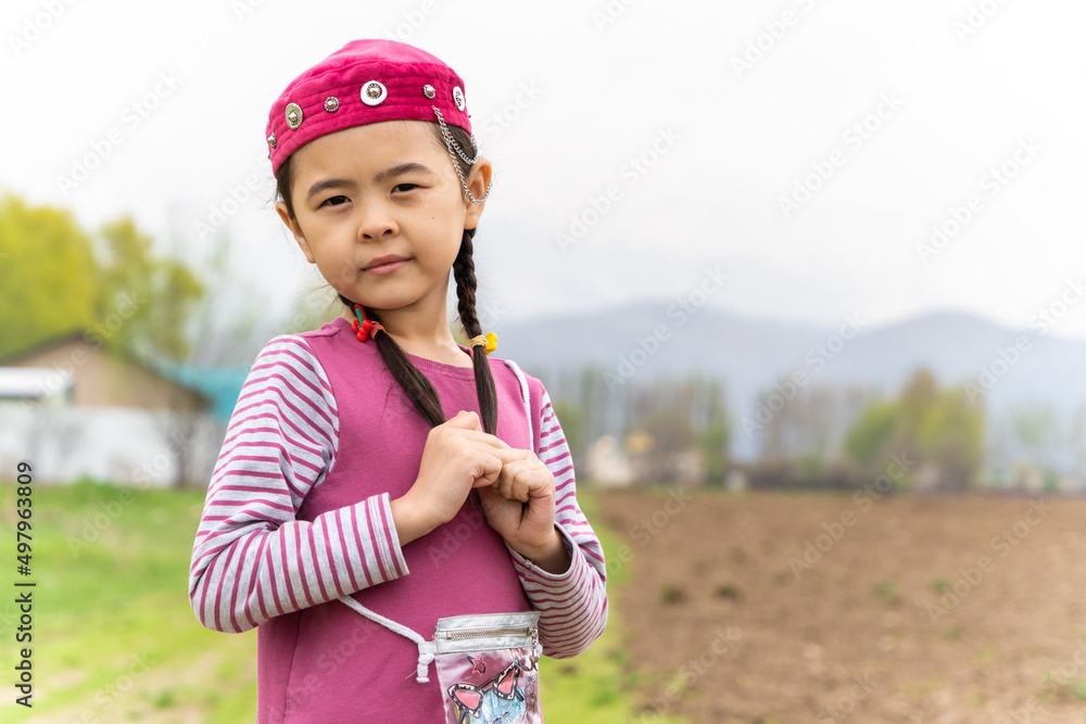 girl in a national headdress. Spring, Nowruz holiday. Kazakh girl. Central Asia, Kazakhstan. girl in a national headdress. Spring, Nowruz holiday. Kazakh girl. Central Asia, Kazakhstan.