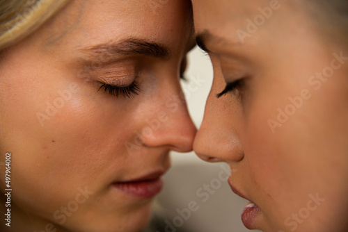 Obraz na plátně Close up of a lesbian couple embracing.