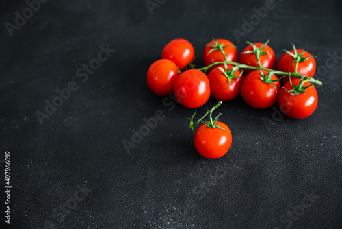cherry tomatoes tomato on a green branch vegetable fresh healthy meal food snack diet on the table copy space food background rustic top view keto or paleo diet veggie vegan or vegetarian food