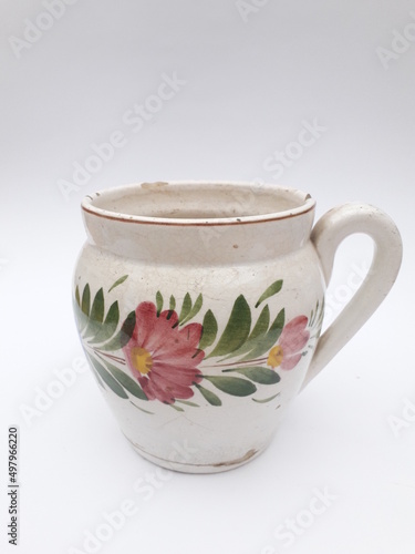 Vintage ceramic cup with folk art pattern isolated
