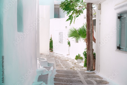 Fototapeta Naklejka Na Ścianę i Meble -  Narrow Greek Cycladic streets on islands, white and blue colors in local town architecture