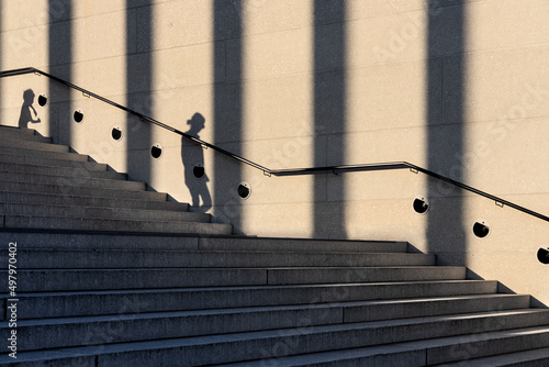 Canvastavla Stairs with the shadow of a woman, a child and columns