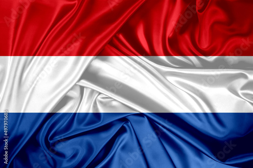 National flag of Netherlands hoisted outdoors. Netherlands Day Celebration.