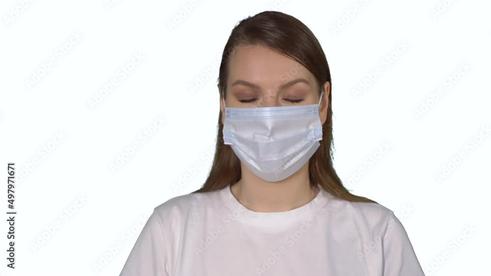 Young caucasian beautiful woman put on protective face mask. Young caucasian beautiful woman put on protective face mask.