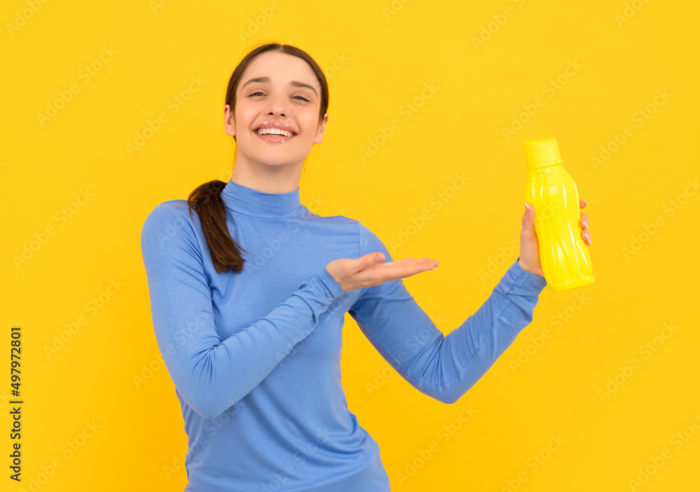 be hydrated. smiling woman presenting mineral water. feel thirsty. young girl with sport bottle be hydrated. smiling woman presenting mineral water. feel thirsty. young girl with sport bottle