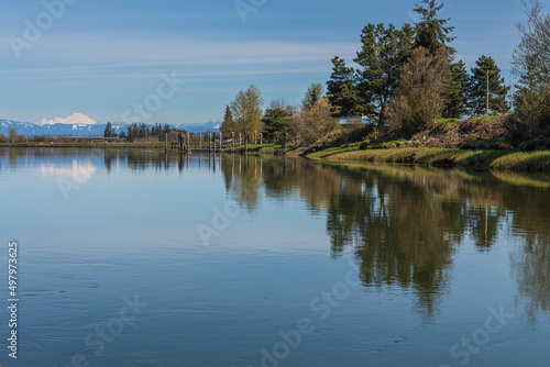 View of Langus Riverfront Park from the Rowing Dock on the Snohomish River in Everett Washington with Mount Baker in the Background